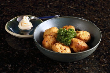 Satsuma age, fried fish dumplings made with potato starch, salt, ginger, and soy sauce, fried in vegetable oil.
