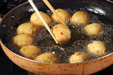 Satsuma age, fried fish dumplings made with potato starch, salt, ginger, and soy sauce, fried in vegetable oil.