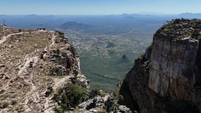 Aerial view from the top of Tundavala cliffs, Angola, overlooking deep canyon valleys and distant plains with breathtaking mountain scenery
