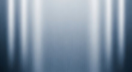 Polished stainless steel plate with a smooth brushed surface and vertical light reflections, an abstract metallic texture for an industrial background