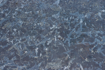 Blue rough textured stone surface with abstract mineral patterns and rugged natural background details