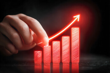 Hand drawing a glowing red rising bar graph with an upward arrow on a dark background symbolizing business growth and success concepts