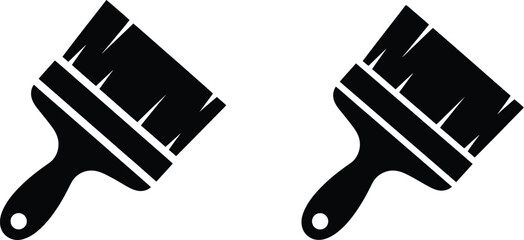 Two black paintbrushes depicted in a simple minimalist graphic style