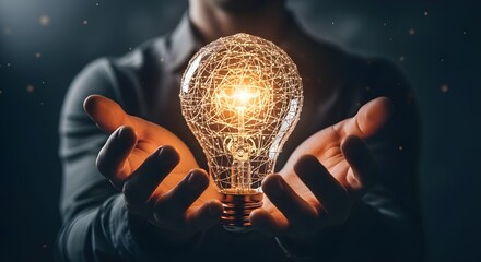 Businessman holding glowing light bulb representing innovation and technological advancement