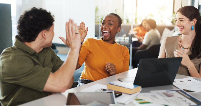 Excited, creative team or laptop with high five in meeting for KPI stats, brand performance or goals. Digital marketing, graphs and people with celebration at agency for campaign approval and results