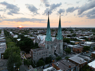 Fototapeta premium Sunset aerial view of church spires over Montreal cityscape. g.