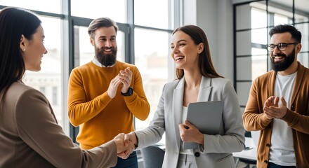 Business people shaking hands and applauding in a modern office setting handshake meeting