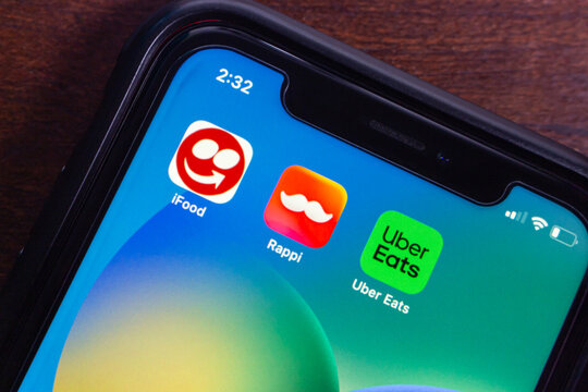 Mexico City, MEXICO - Sep 21 2025 : Smartphone showing icons of iFood, Rappi, and Uber Eats apps.