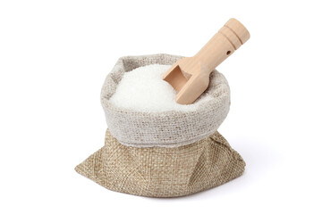 White granulated sugar in a jute sack with a wooden spoon scooping it up. isolated on white background.