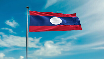Vibrant national flag of Laos proudly waving on a tall flagpole against a bright blue sky, symbolizing national identity