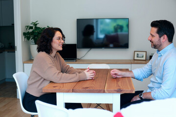 Young Woman and Man Having Conversation Indoors
