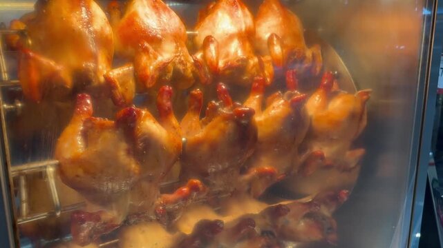 Footage of oven while roasting chickens.Roasting a chicken offers a variety of satisfying meal options throughout the week.
