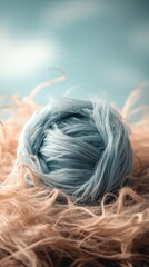 Blue Textured Fiber Rolled on Soft Natural Background