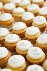 Whimsical cupcake tower with pastel frosting and sprinkles, soft focus background. A high angle, close up studio shot of a whimsical tower of perfectly frosted cupcakes. The cupcakes are adorned with