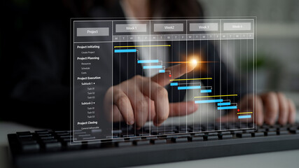 A business professional interacts with a digital Gantt chart on a computer keyboard, representing effective project management and visualization for successful planning. Tessel