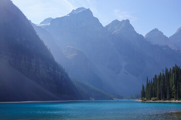 Sunny day over turquoise mountain lake in Canadian Rockies