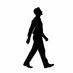Silhouette of a man walking confidently forward looking up.