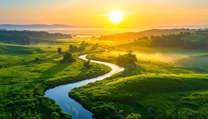Scenic aerial view of a winding river flowing through vibrant green fields at sunrise