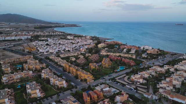 Aerial view of a residential area of Playa nudista Vera in Playa de veras. Almeria Spain - Many residential houses with swimming pool in the shore of mediterranean .