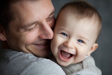 Father shares a joyful moment with his baby, embracing and expressing unconditional love in a warm, cozy setting