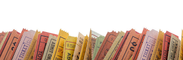 Old tickets stuck between the pages of a rolled-up magazine, close up view