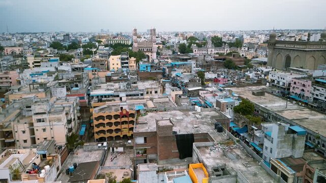 Aerial view of Hyderabad Old city with many colorful buildings around historic Charminar monument.in India.