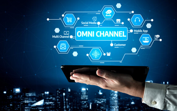 A captivating representation of an omni channel strategy showcasing a hand holding a tablet amidst a digital network of customer engagement tools in a modern city setting. Tessel
