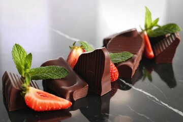 Decadent chocolate covered strawberries with mint garnish