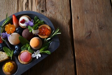 Delicious dessert assortment on rustic wood table presentation styled beautifully