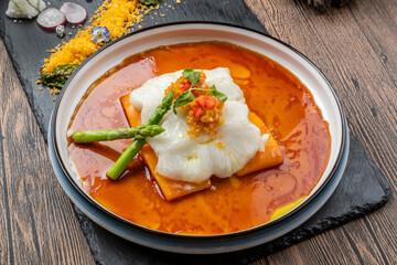 Deep-sea cod belly served on an exquisite porcelain plate with sauce