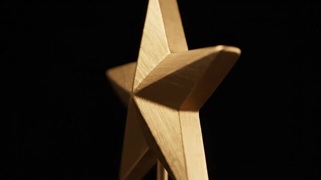 Golden Star Award on Black Background, Symbol of Achievement.