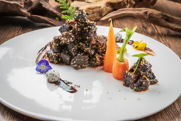 Black pepper squid ink yak cubes