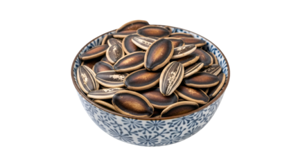 Invigorating sunflower seeds brimming from patterned bowl offer natural healthy snacking with rich nutty flavor and satisfying crunch, a wholesome treat