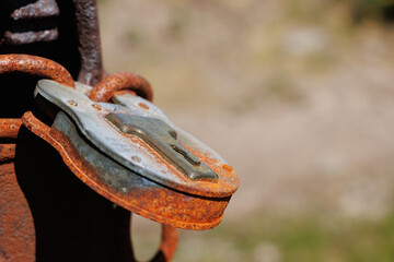 Close-up of old-fashioned metal padlock on gatepost