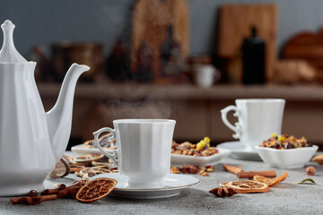 Herbal tea with ingredients on an old stone table.