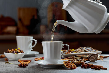 Herbal tea is poured into a cup.