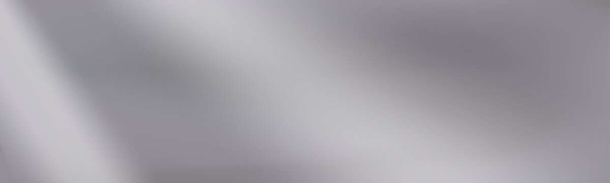 Smooth silver mirror gradient background with soft blur. Gentle metallic reflections highlight the layered silver gradient tone.