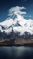 Majestic Snowcapped Mountain Peak Above Pristine Alpine Lake, Sichuan China