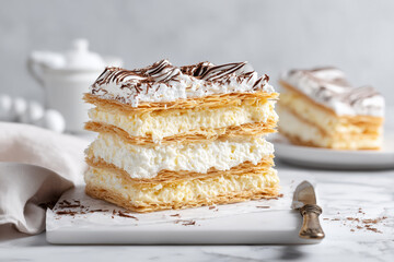Indulge in decadent elegance with this layered cream slice, perfect for dessert menus, bakery promotions, and sweet treat advertising. Get yours today!