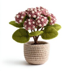 Crocheted Hydrangea Plant With Pink and White Flowers in a Textured Beige Pot Isolated on White Background