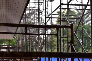 Obraz premium Scaffolding for building improvements, Renovation scaffolding enveloping historical building facade