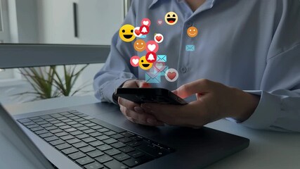 Woman using smart phone with emoticon icons of Social Media.Interactive with friends on chat with emoticon feedback.Social media,marketing, like,social network,blog,live,chat reaction and livestream. - Powered by Adobe