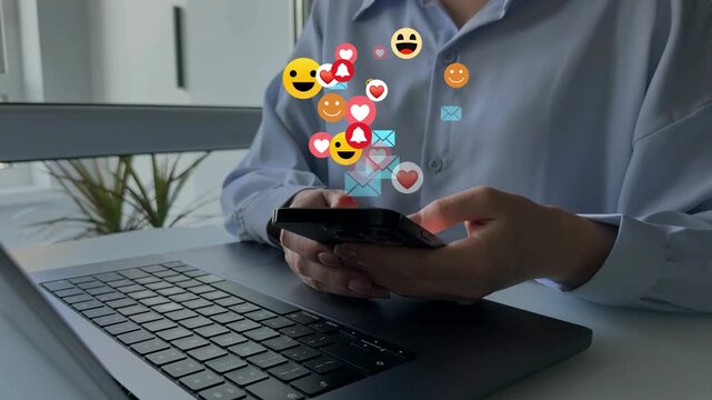 Woman using smart phone with emoticon icons of Social Media.Interactive with friends on chat with emoticon feedback.Social media,marketing, like,social network,blog,live,chat reaction and livestream.	