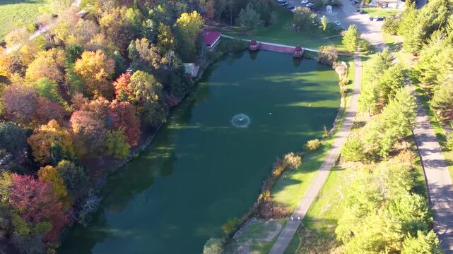 Aerial view of Swan Ghat at ISKCON New Vrindaban, West Virginia, surrounded by vibrant fall foliage and golden autumn trees at this iconic Vaishnavism Hindu temple site