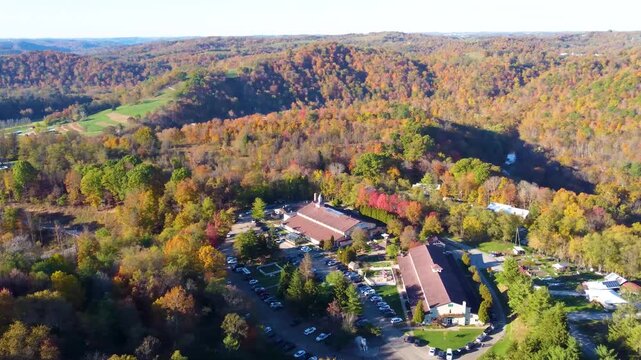 360&deg; aerial drone panoramic view of Prabhupada&rsquo;s Palace of Gold at ISKCON New Vrindaban, surrounded by vibrant fall foliage and golden autumn colors across the landscape.