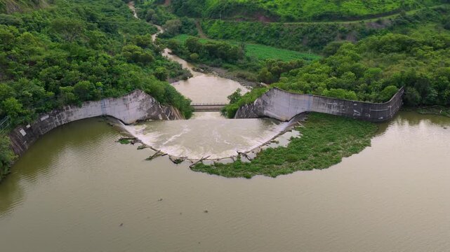 Concrete Spillway With Foamy Rushing Water At Presa EL Carrizo In Tamazula de Gordiano, Jalisco, Mexico. Aerial Drone Shot