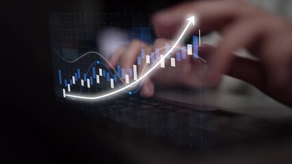 A close-up view of hands typing on a keyboard, enhanced by a digital graph that symbolizes financial growth and data analytics in a contemporary workspace setting. Copula - Powered by Adobe