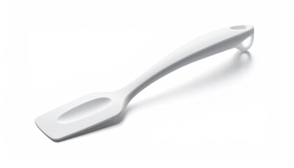 Obraz premium Simple, white spatula with curved handle on a bright surface