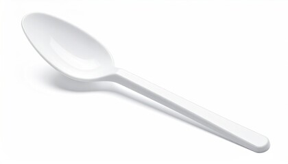 Glossy, white plastic spoon on a plain white surface