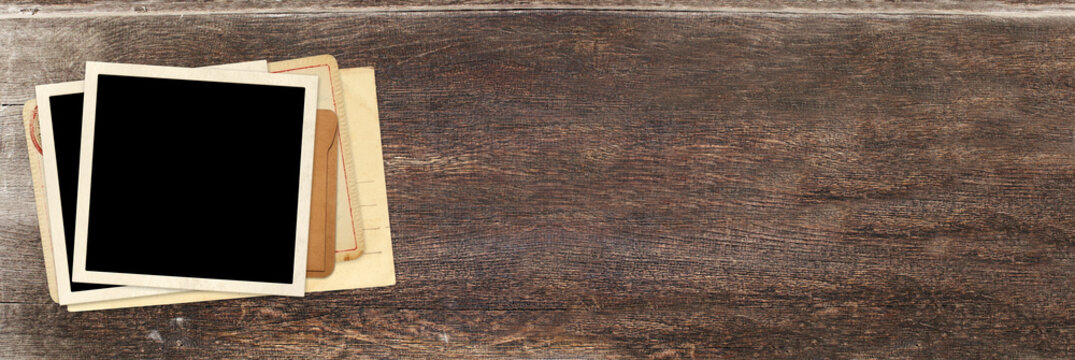 Horizontal banner with two retro photo, vintage envelope and cards on wooden board. Nostalgic scrapbooking mockup template is perfect way to express creativity and evoke a sense of warm memories